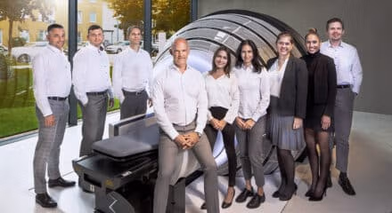 Group of physicians from European Radiosurgery Center in Munich Germany, surrounding a ZAP-X